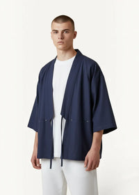 Navy blue cotton haori jacket with subtle vertical stitching and matching drawstring ties for stylish layering