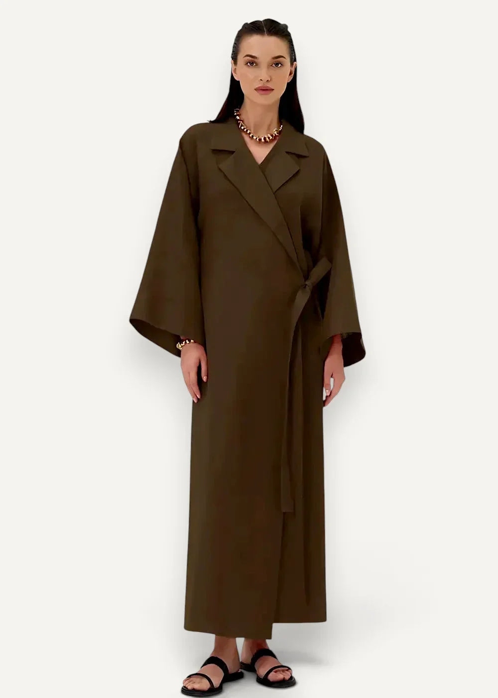 Cotton kimono dress wrap-style olive green coat with wide sleeves and belted waist visible from the front