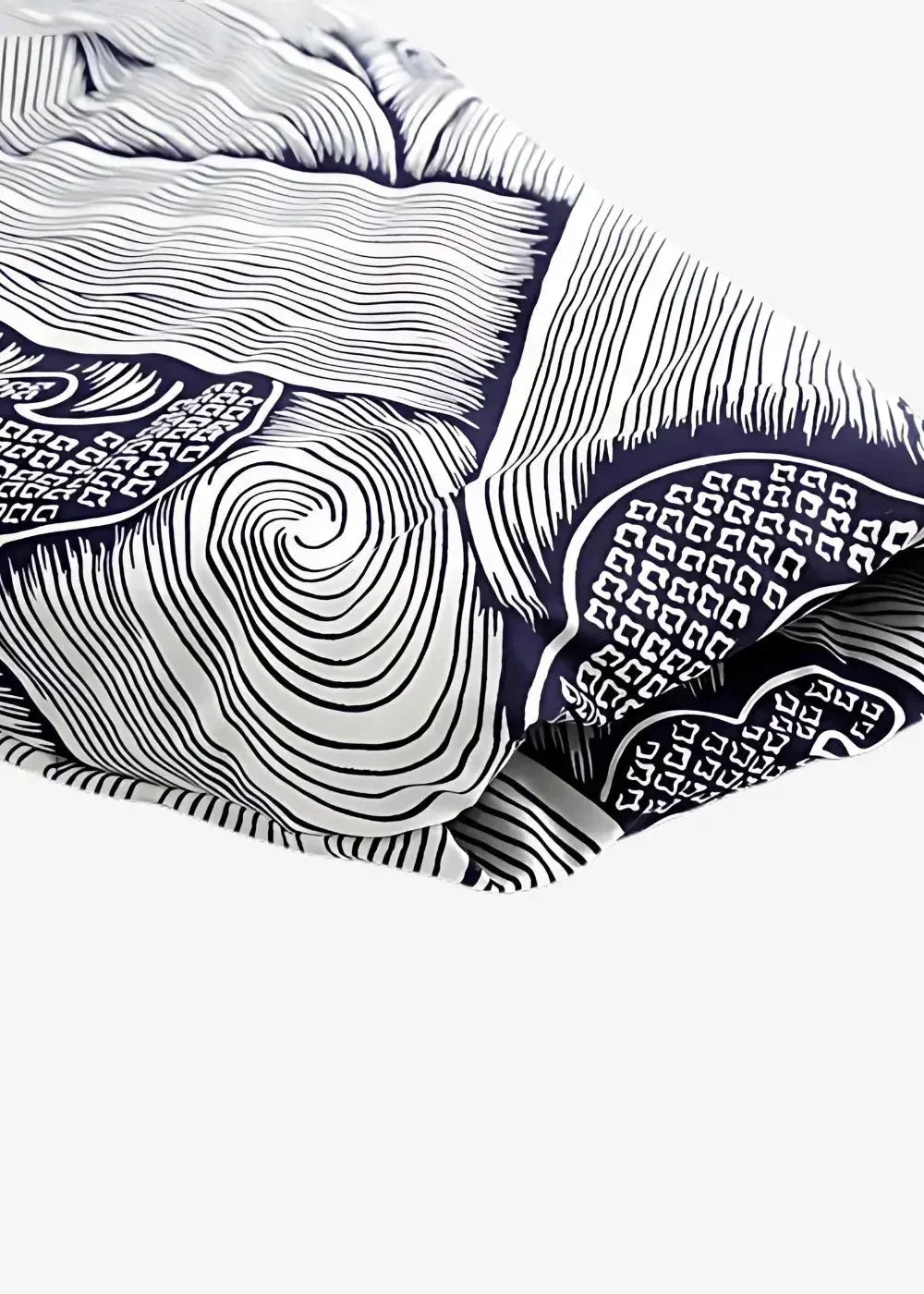 Cotton kimono jacket in navy blue and white with intricate swirling line art and geometric fabric patterns
