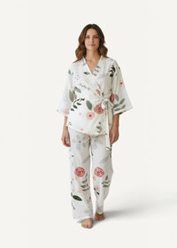 White cotton kimono pajamas with soft flowing fabric and delicate pink roses accented by green leaves