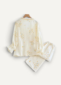 Cream kimono pajamas in cream with delicate yellow and blue floral embroidery on lightweight flowing fabric