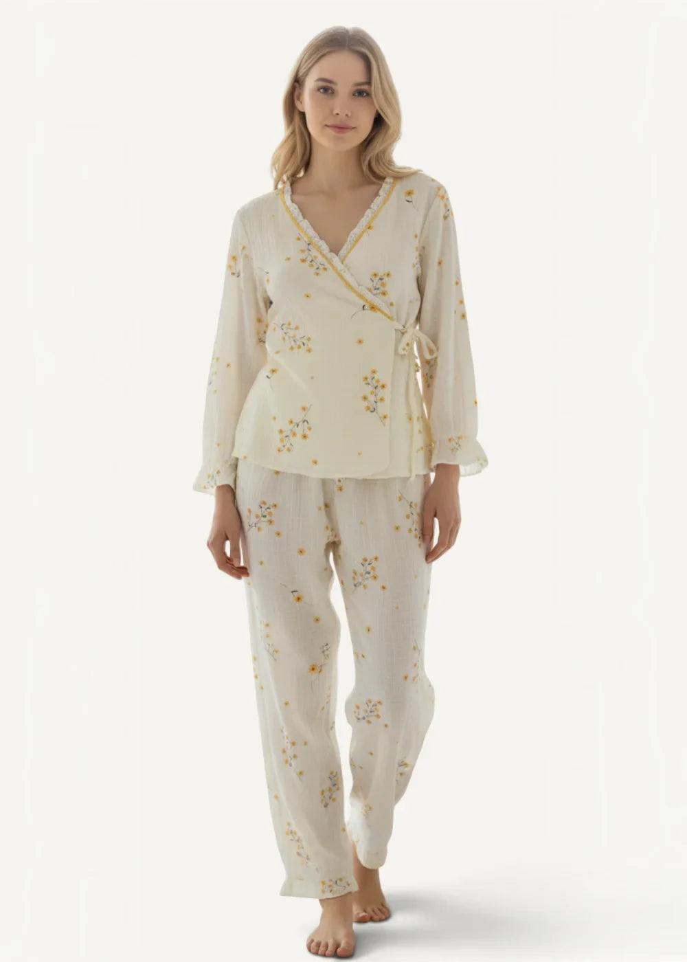 Cream kimono pajamas with cream-colored fabric and delicate yellow floral embroidery featuring a wrap-style top