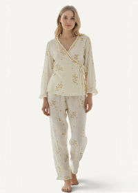 Cream kimono pajamas with cream-colored fabric and delicate yellow floral embroidery featuring a wrap-style top