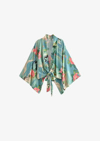 Cropped kimono with wide sleeves and tied waist in light blue fabric featuring pink blossoms and green leaves