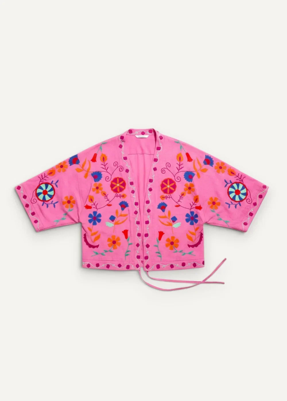 A vibrant pink embroidered kimono jacket with colorful floral and circular thread patterns in blue orange red and yellow