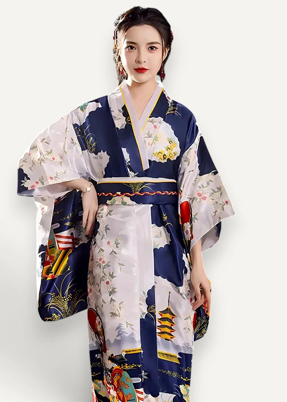 A woman wearing a navy blue and white floor length satin robe with intricate floral and traditional Japanese motifs