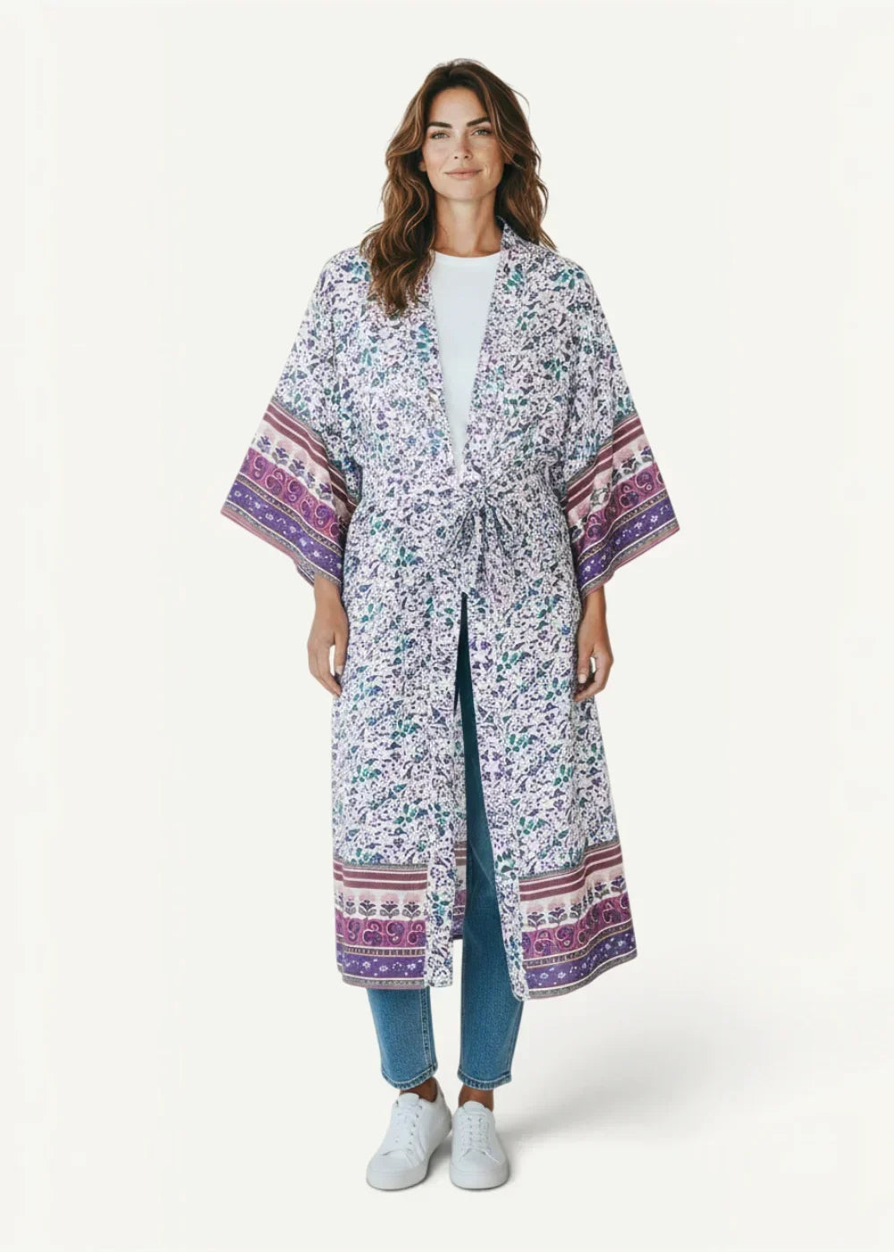 Long white kimono-style coat with purple green floral pattern and bold geometric bands at cuffs and hem floral cover up kimono