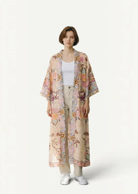 A flowing long-sleeved floral kimono cardigan in soft pastel tones with delicate botanical print