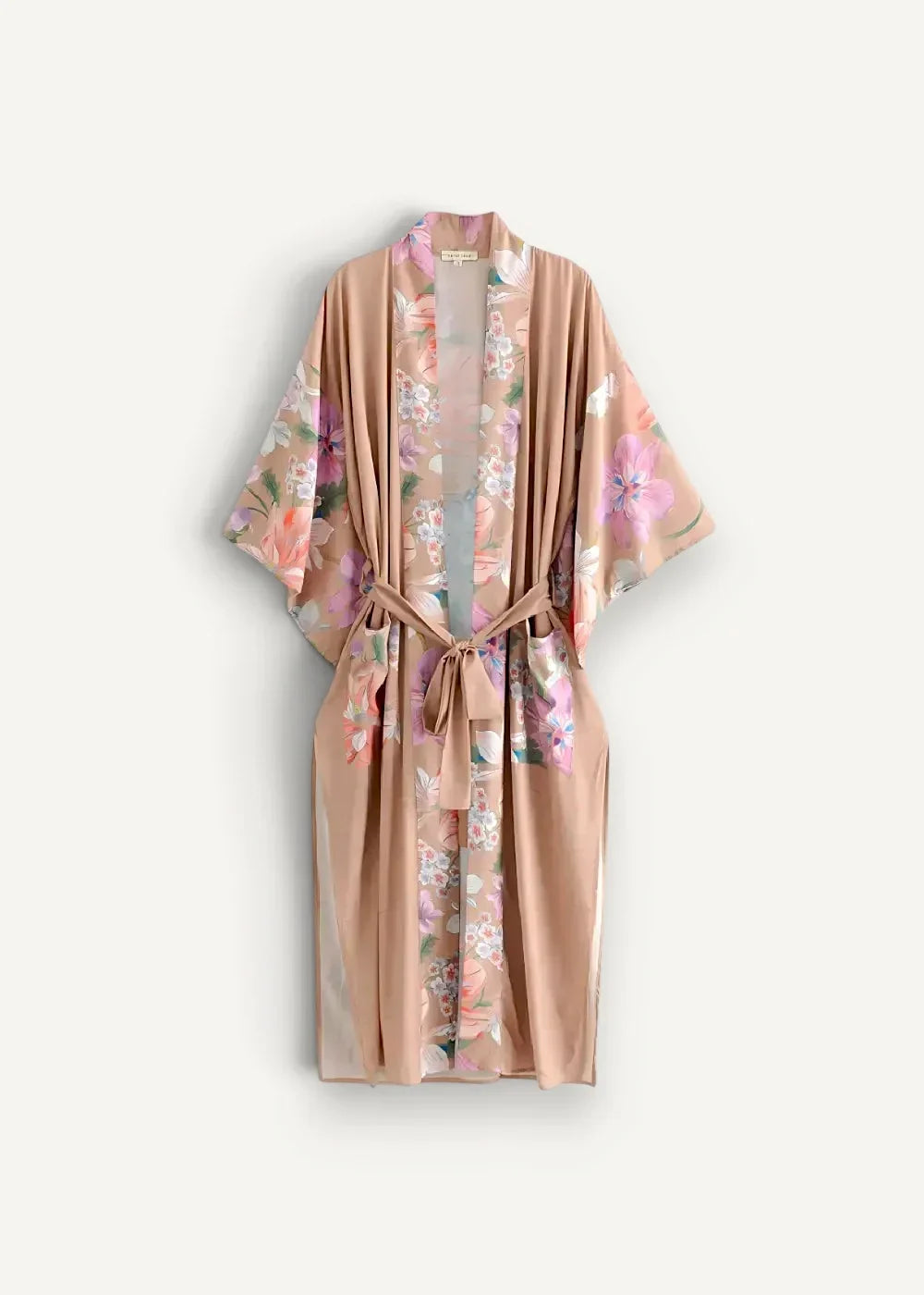 A soft peach-colored silk floral kimono cardigan long with pink lavender and green delicate patterns