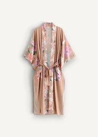 A soft peach-colored silk floral kimono cardigan long with pink lavender and green delicate patterns