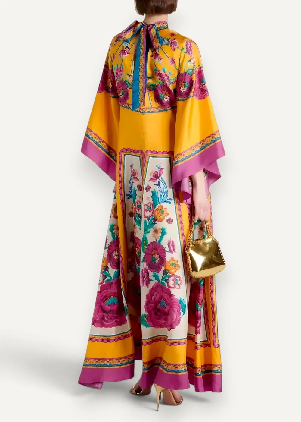 A vibrant yellow and magenta floral kimono dress with intricate embroidered borders made of silky fabric