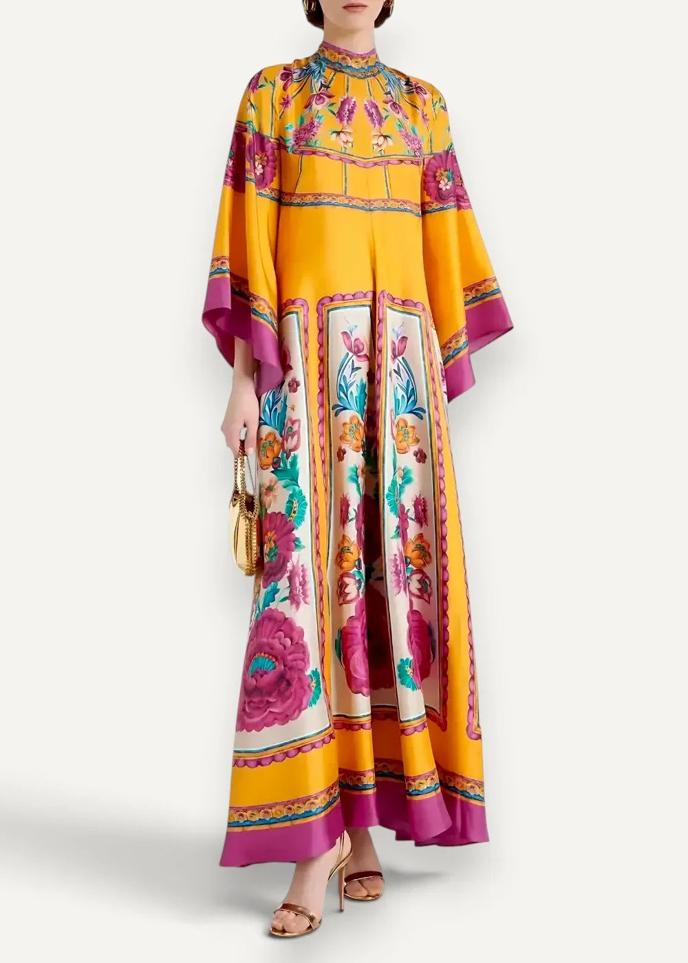 A vibrant yellow and magenta floral kimono dress with wide flowing sleeves in a maxi length style