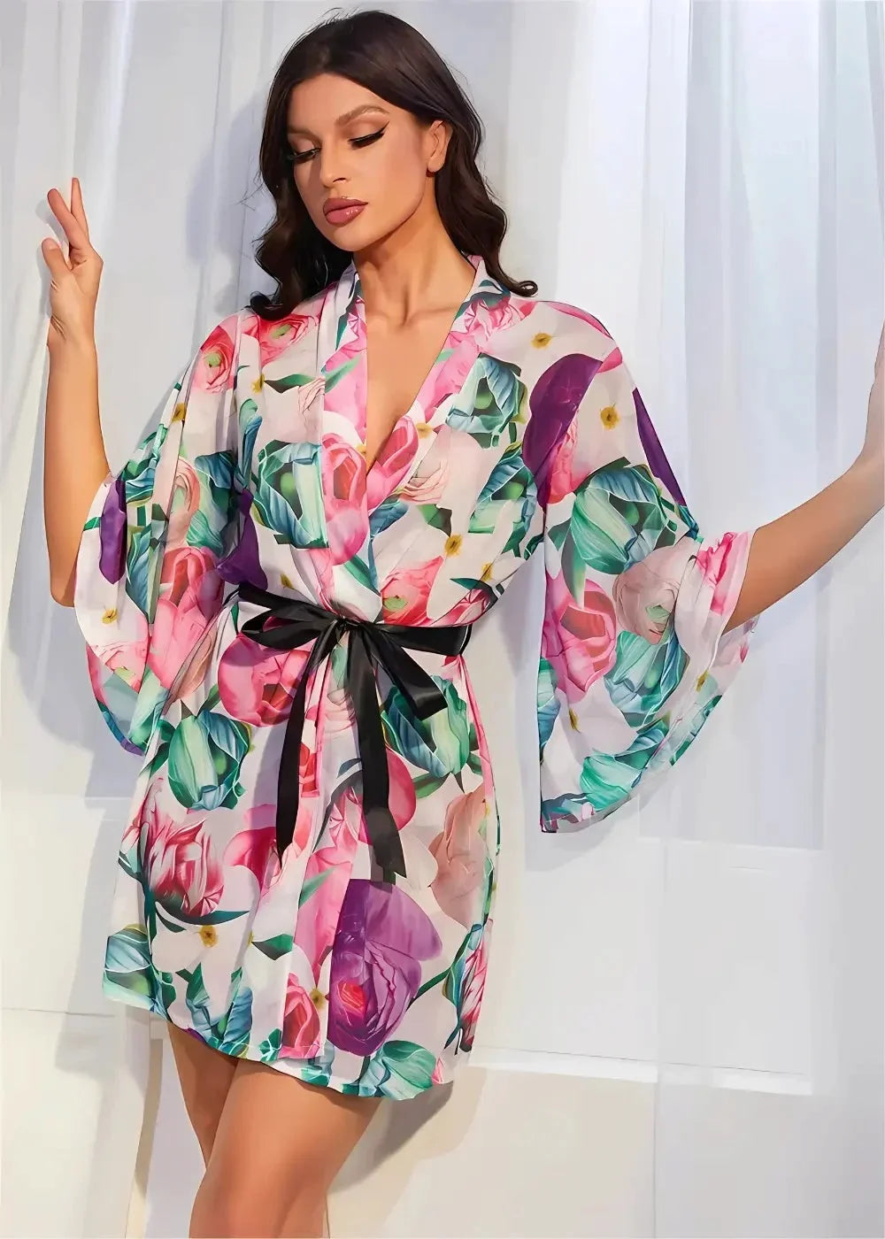 Floral kimono robe with vibrant floral print wide flowing sleeves and black satin belt in lightweight fabric