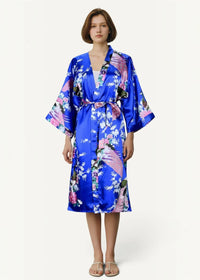 Floral satin kimono in vibrant blue with floral and peacock pattern featuring wide sleeves and a matching belt
