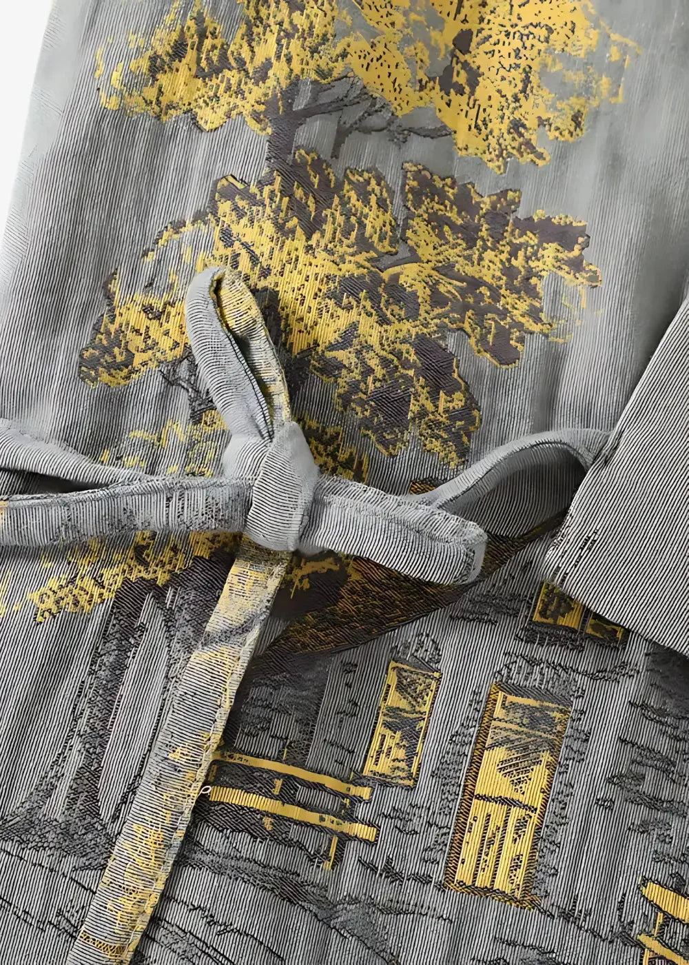 Gray kimono pajamas featuring a gray corduroy robe with yellow and black tree and building print tied at the waist