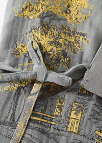 Gray kimono pajamas featuring a gray corduroy robe with yellow and black tree and building print tied at the waist