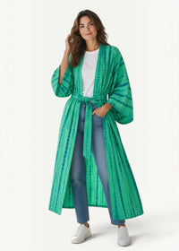 Green kimono cover up with long flowing tie dye fabric and matching belt tied at the waist