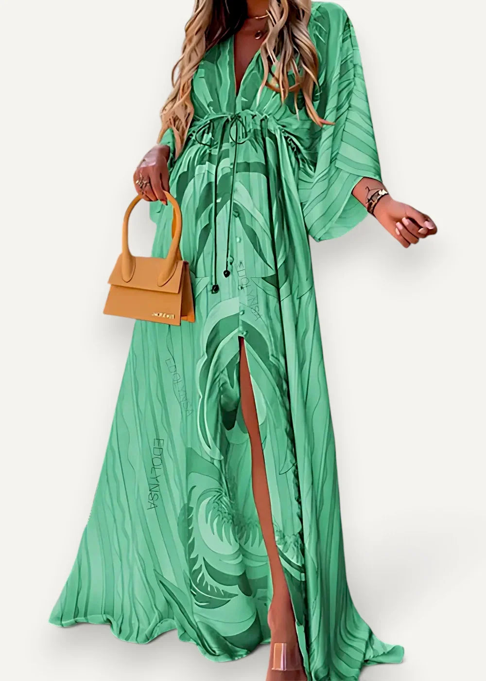 Emerald green kimono maxi dress with bold leafy pattern flowing fabric and a stylish side slit