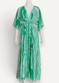 Green kimono maxi dress with flowing emerald green fabric tropical leaf pattern v-neckline and drawstring waist