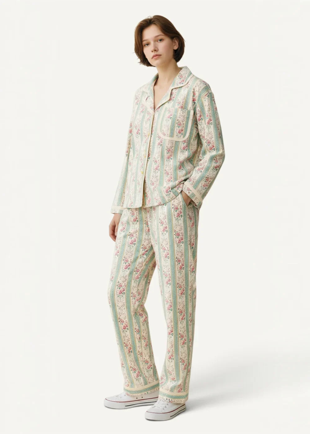 Green striped kimono pajamas in soft pastel stripes with delicate floral patterns in muted pink and green tones