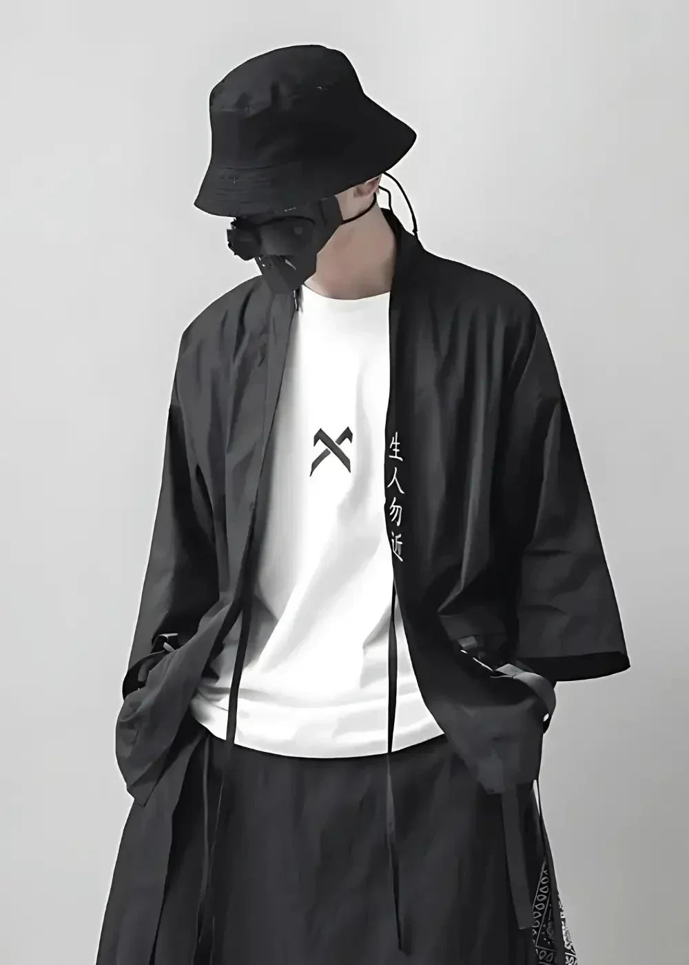 Man wearing the black haori coat open over a white tee, styled with a black bucket hat