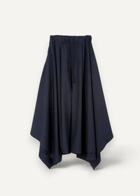 Black high-waisted asymmetrical skirt with elastic waistband and flowing silhouette shown from the back in haori coat style
