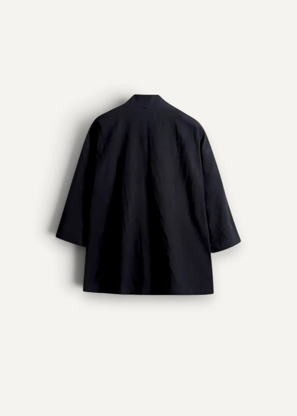 Black minimalist haori kimono jacket with three quarter sleeves and relaxed fit shown from the front