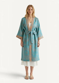 Teal and gold patterned Japanese cotton kimono robe made of silk with a matching belt tied at the waist