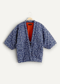 Blue floral-patterned quilted japanese haori jacket with vibrant orange interior lining for stylish layering