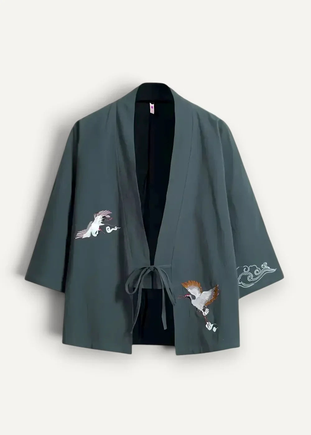 Dark green embroidered japanese haori kimono jacket with white and brown crane motifs on fabric