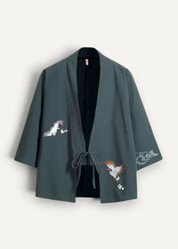 Dark green embroidered japanese haori kimono jacket with white and brown crane motifs on fabric