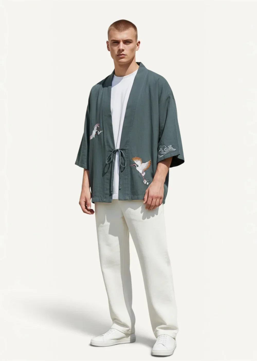 Dark green loose-fitting japanese haori kimono jacket with embroidered bird motifs on sleeves and front
