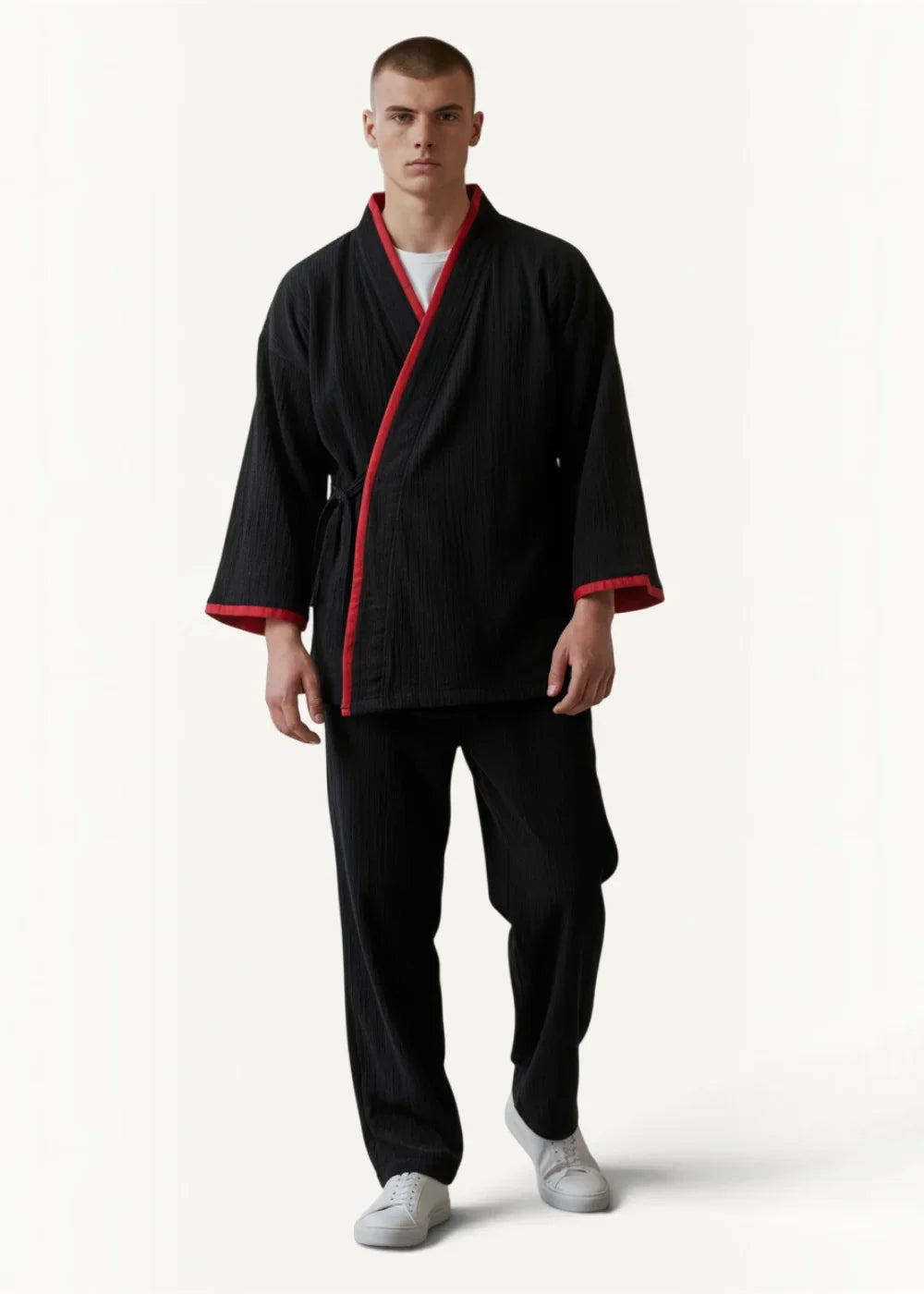 Black kimono pajamas jacket with red trim along collar cuffs and front opening in traditional Japanese style