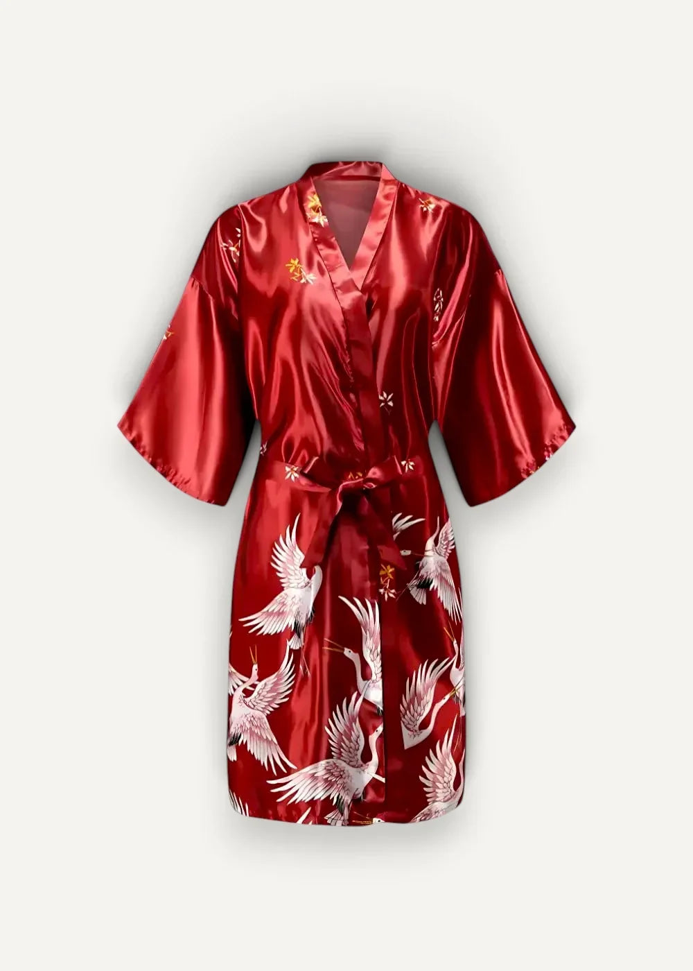 A vibrant red satin japanese kimono robe female with elegant white and gold crane motifs and a classic wrap design