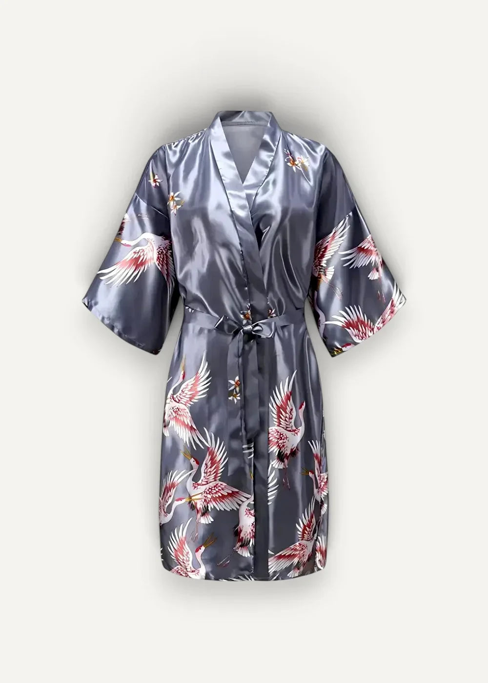 A sleek dark gray satin Japanese kimono robe with vibrant red and white cranes in flight pattern