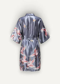 A sleek satin-gray Japanese kimono robe adorned with a vibrant pattern of red and white cranes in flight