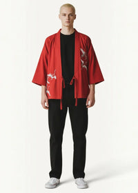 Red embroidered japanese kimono style jacket with white crane motifs and matching drawstring closures