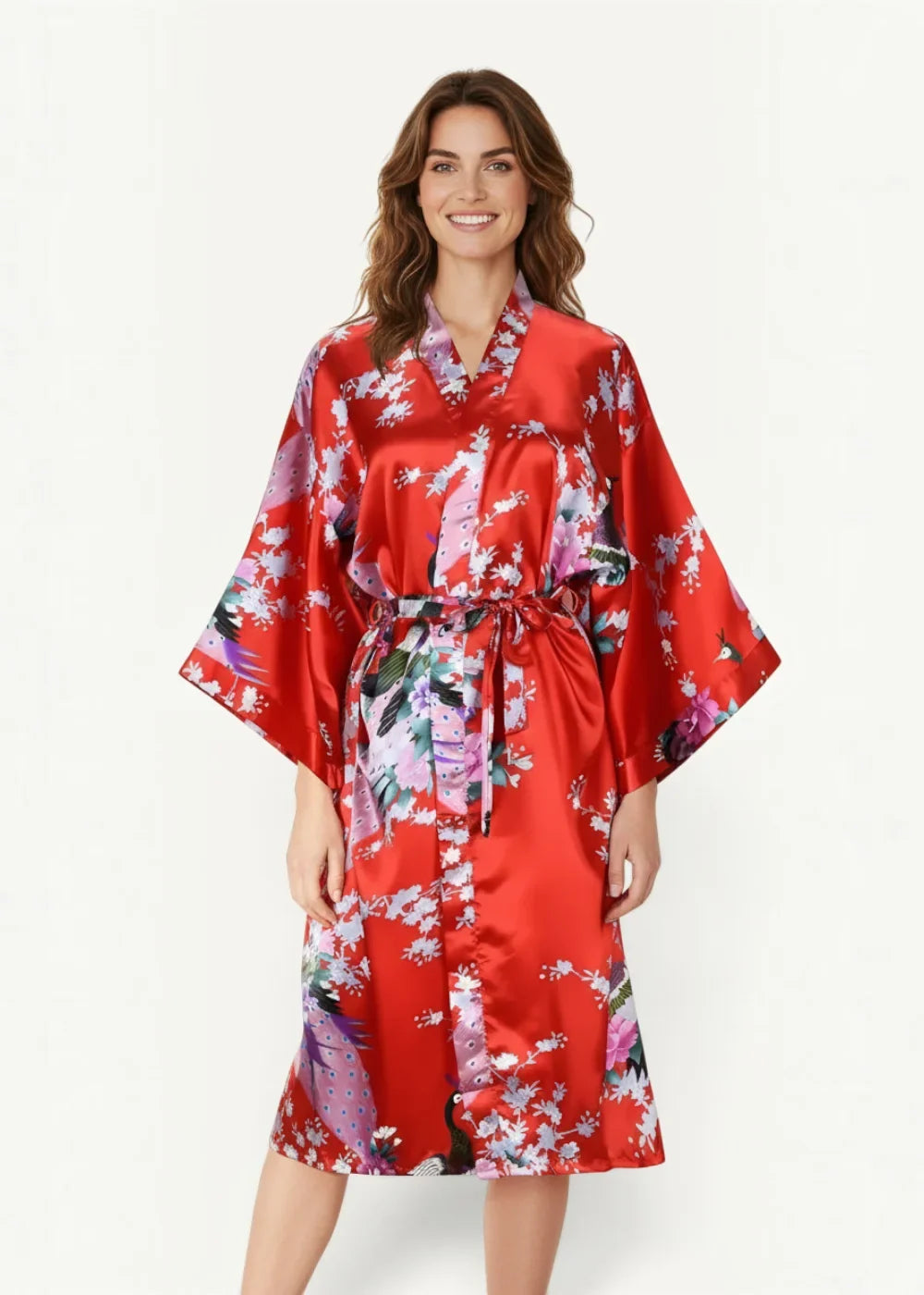 A vibrant red Japanese satin robe with a floral peacock pattern tied at the waist