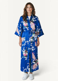 A vibrant royal blue Japanese silk robe with a delicate floral and bird pattern in soft pinks whites and greens