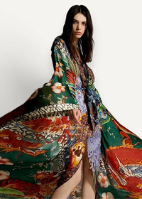 A flowing long-sleeved Japanese traditional kimono with vibrant green fabric and intricate red dragon and floral motifs