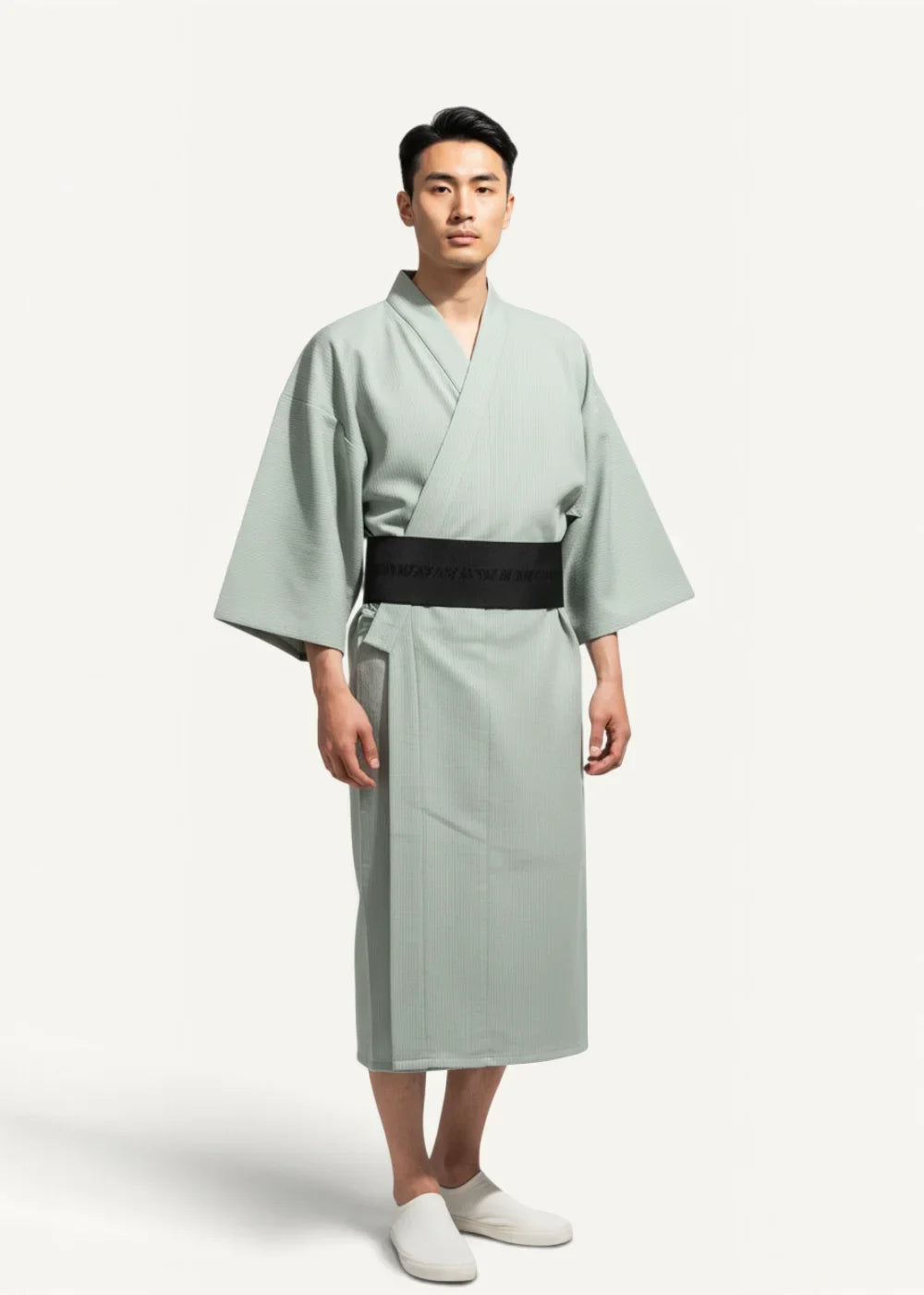 Japanese yukata male featuring a light green loose-fitting kimono with a wide black obi belt front view