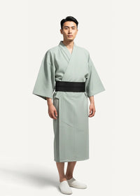 Japanese yukata male featuring a light green loose-fitting kimono with a wide black obi belt front view