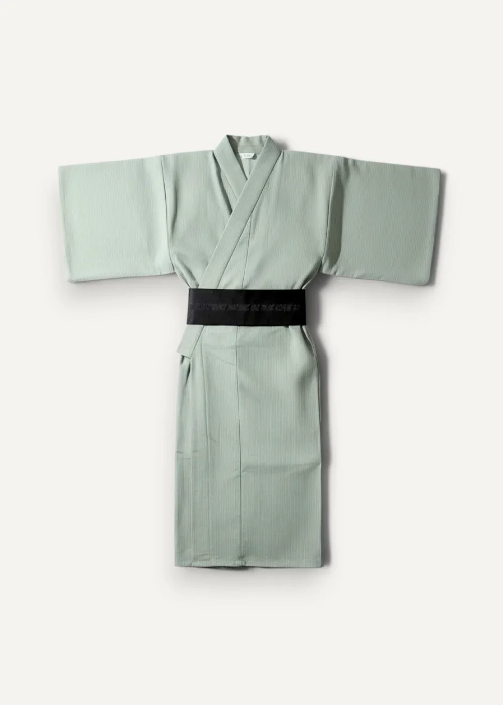 Minimalist sage green Japanese yukata male with a sleek black belt featuring subtle white text