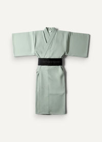 Minimalist sage green Japanese yukata male with a sleek black belt featuring subtle white text
