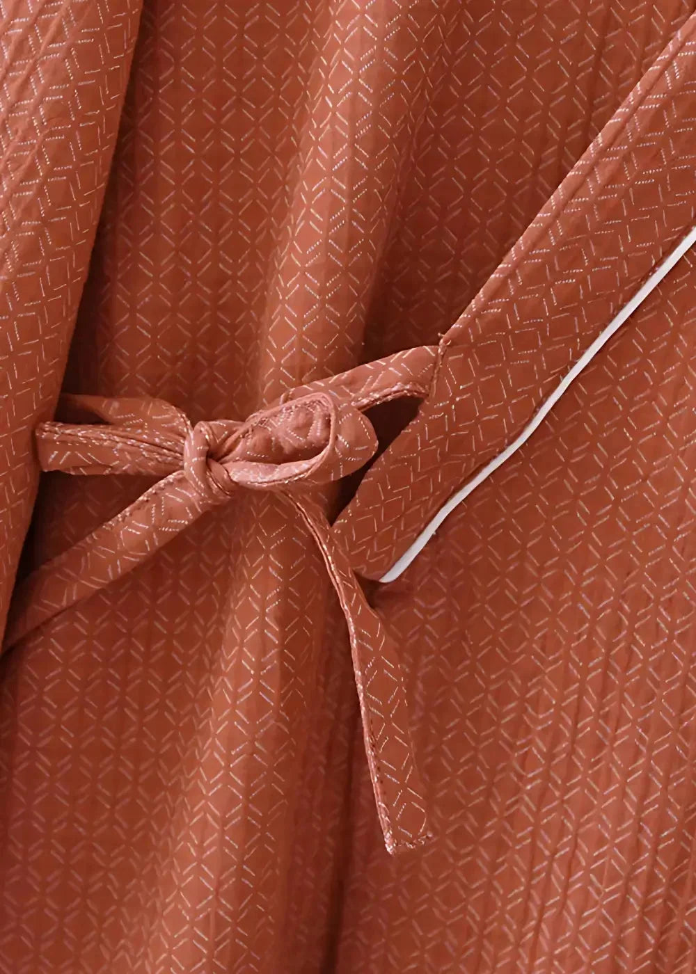 Kimono bathrobe men’s rust-colored with subtle geometric weave pattern white piping and fabric belt tied at waist