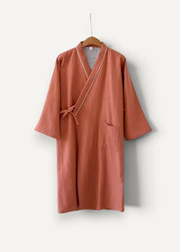 Men’s kimono bathrobe in soft terracotta textured cotton with subtle gold trim along collar and front opening