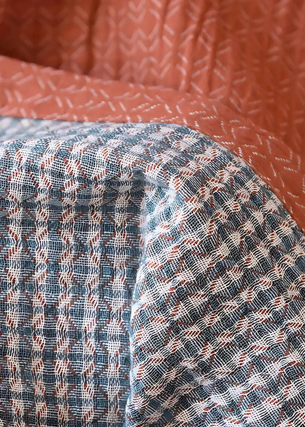 Men’s kimono bathrobe with a textured woven quilt geometric pattern in blue white and rust shades