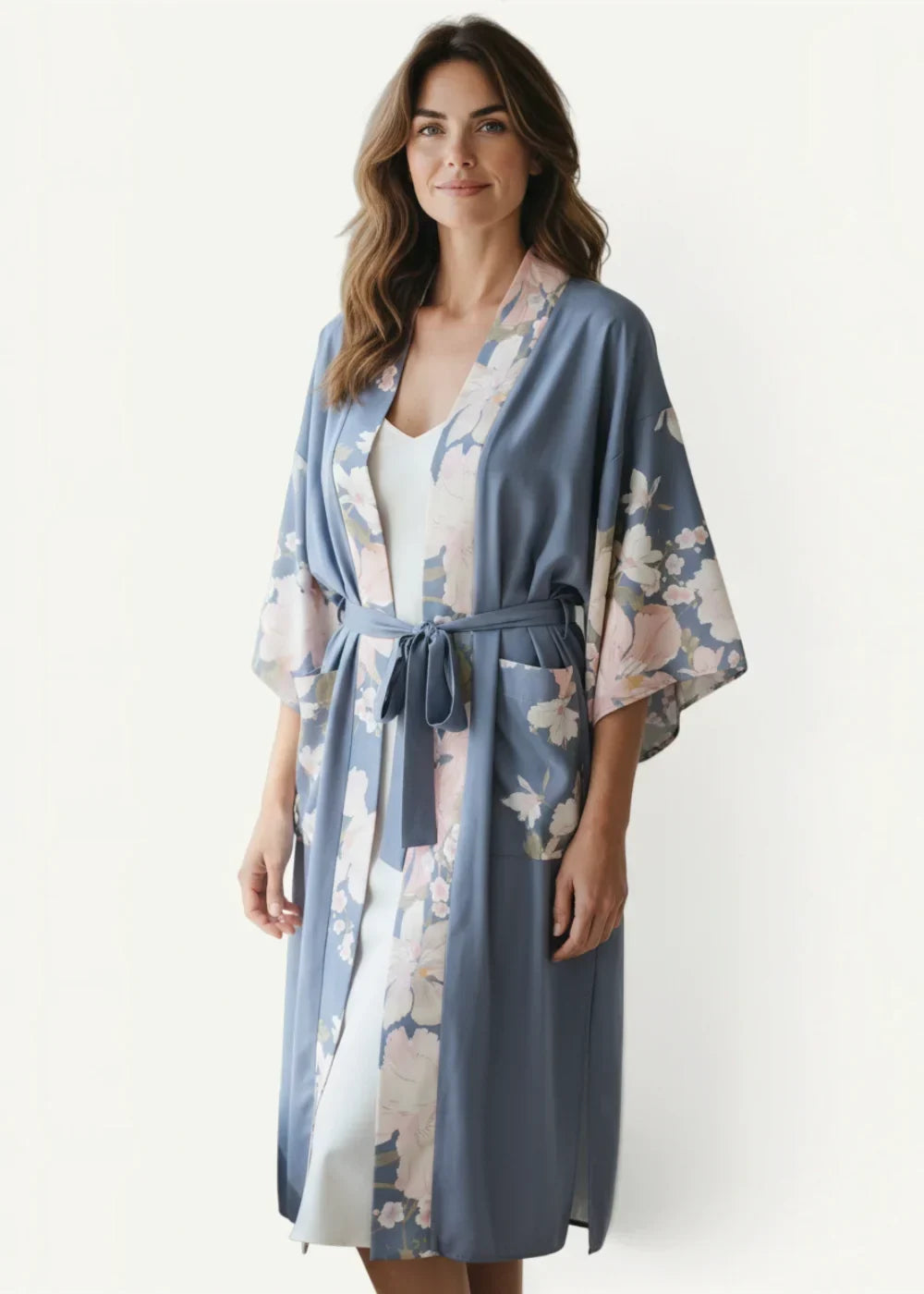 Kimono cardigan cover up in soft blue satin fabric with pink floral design and matching belt for lightweight layering