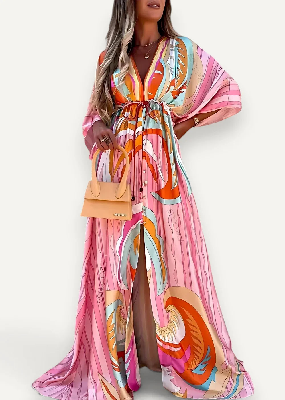 A flowing long-sleeved kimono dress beach cover up in vibrant pink with abstract orange and teal swirls