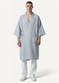 Light blue cotton kimono dressing gown with subtle constellation pattern v-neckline and tied waist front view